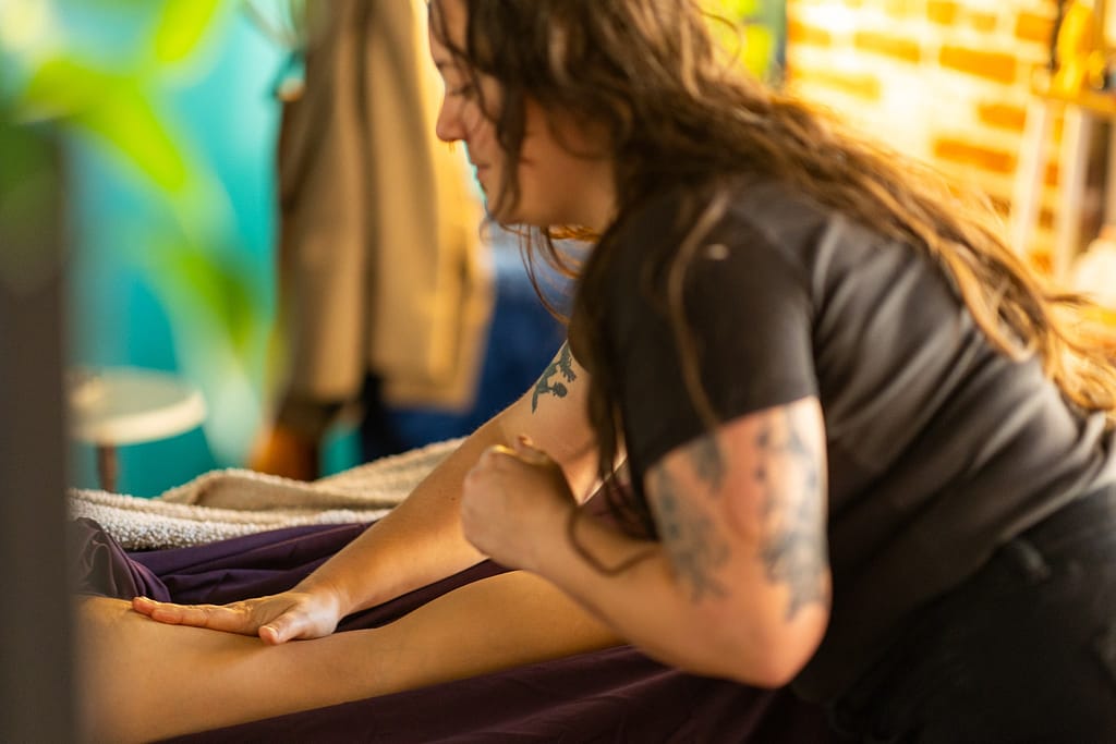 Licensed massage therapist performing gentle manual lymphatic drainage at Tranquil Therapy Wellness in Lancaster, PA.